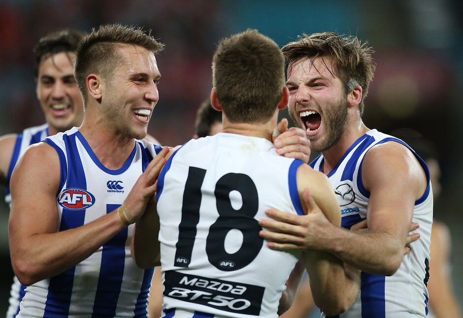 AFL 2015 First Semi Final - Sydney v North Melbourne SYDNEY, AUSTRALIA - SEPTEMBER 19: Luke McDonald of the Kangaroos celebrates with Shaun Atley after Atley kicked a goal during the 2015 AFL First Semi Final match between the Sydney Swans and the North Melbourne Kangaroos at ANZ Stadium, Sydney, Australia on September 19, 2015. (Photo by Craig Golding/AFL Media)